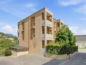 A multi-story building with a sign reading 'LE VIRGINIA RESIDENCE.' - Convenient Riviera Retreat With Pool (Grasse)