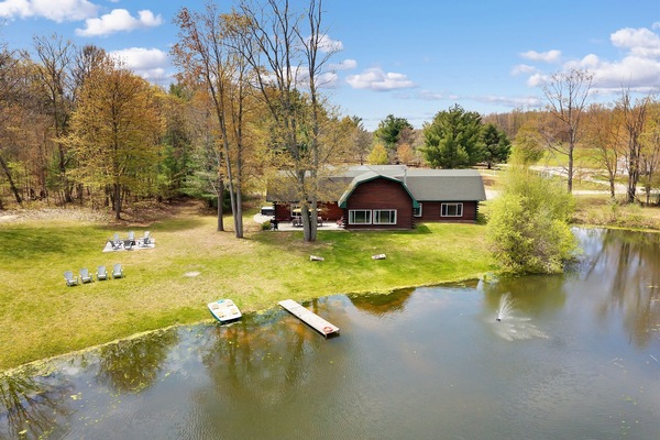 Aerial view of our home, dock, and paddle boat from the pond.