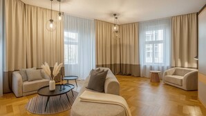 A spacious living room with two sofas, a coffee table, and a side table.