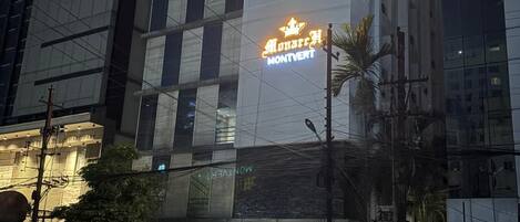 A modern building with a prominent sign for 'MONTYERT' hotel.