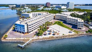 A coastal hotel with multiple buildings, a parking area, and a beachfront view. - Spacious Tampa Bay Suite w/ Conservation Views (Tampa)