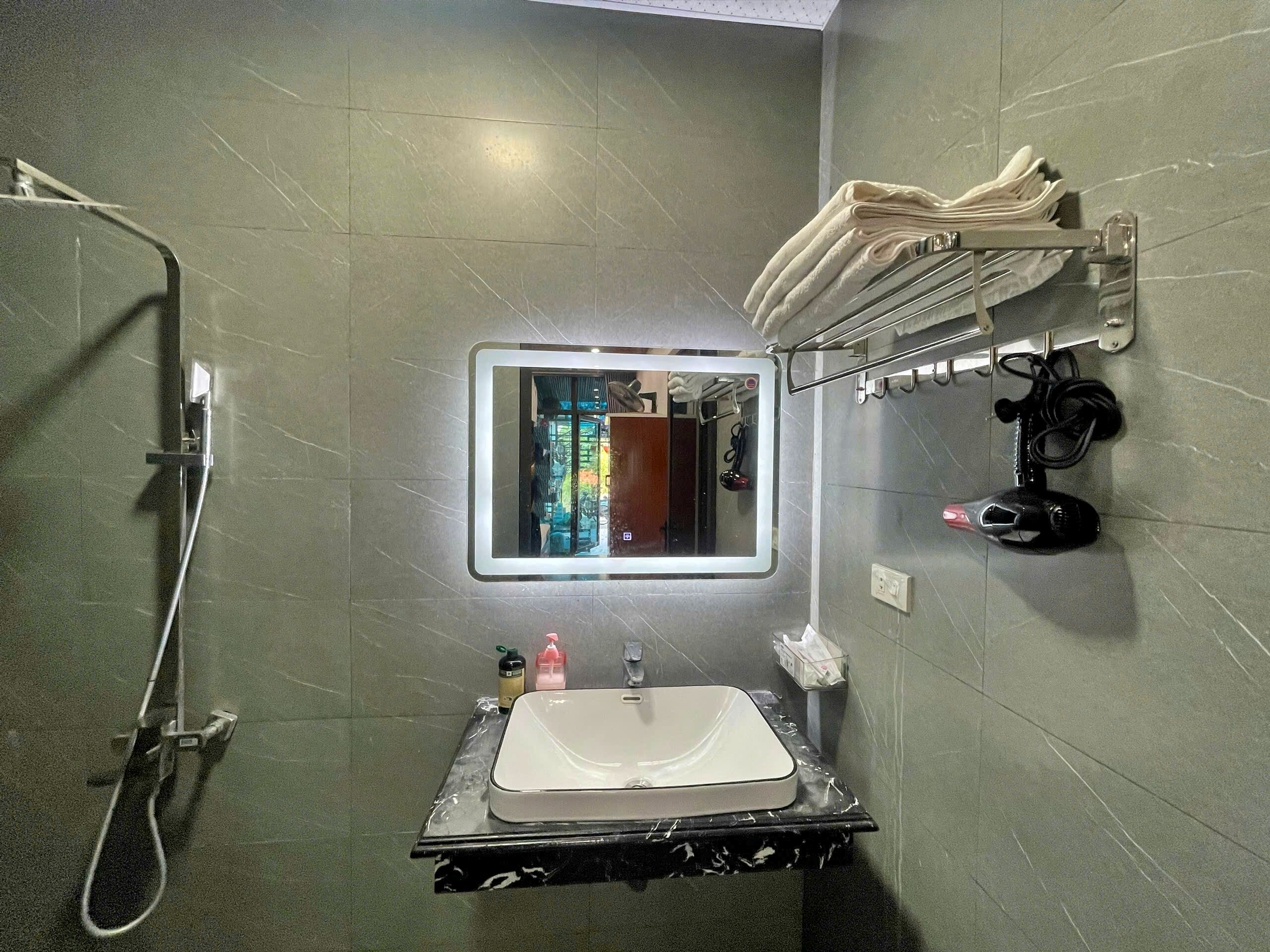 Hair dryer, slippers, towels, soap