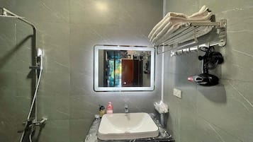 Hair dryer, slippers, towels, soap