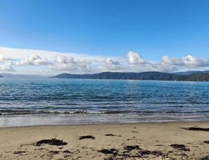 Beach - Slow Stay Seatoun · A Calm Coastal Escape (Wellington)