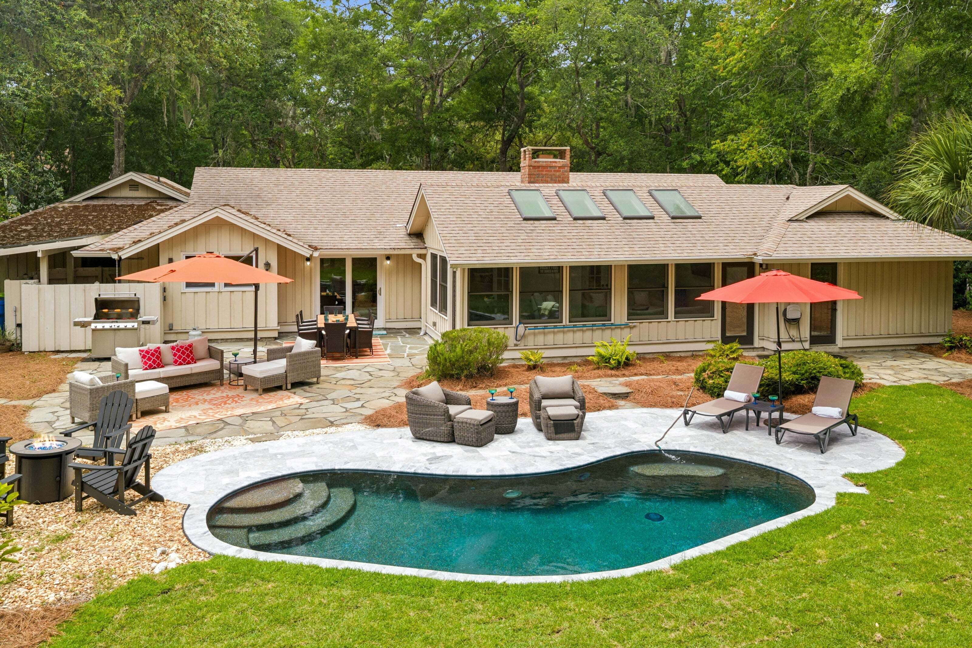 Lounge by the sparkling pool, gather around the fire pit, or unwind beneath the shade of mature live oaks.