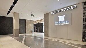 A hotel lobby with a sign for 'South Tower Raphael Penthouse Suites.' - The Raphael Penthouse Suites (Johannesburg)