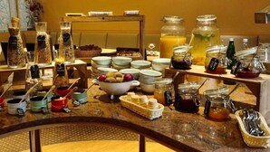 A breakfast buffet with various food items and condiments. - 2 Person Holiday Park Home in Dortmund (Dortmund)