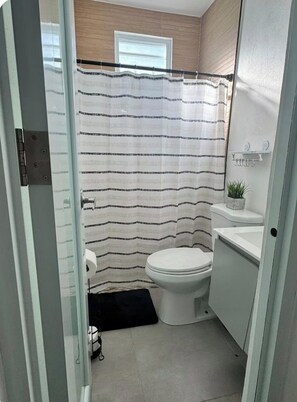 Shower, towels, soap, toilet paper