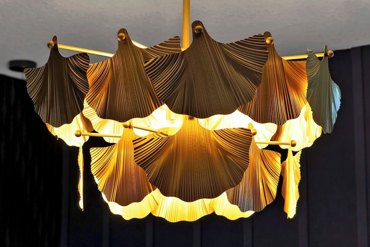 A chandelier with multiple tiers and a central light source.