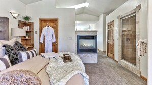 A modern living room with a fireplace, a cozy seating area, and a walk-in closet. - Waterfront  Hot Tub,Game room, Tahoe Keys MV25 (South Lake Tahoe)