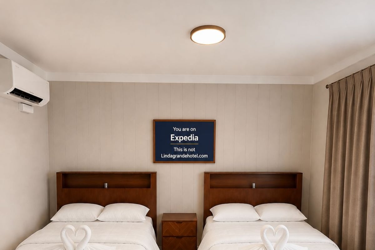 A hotel room with two beds, a nightstand, a wall-mounted sign, and a window with curtains.