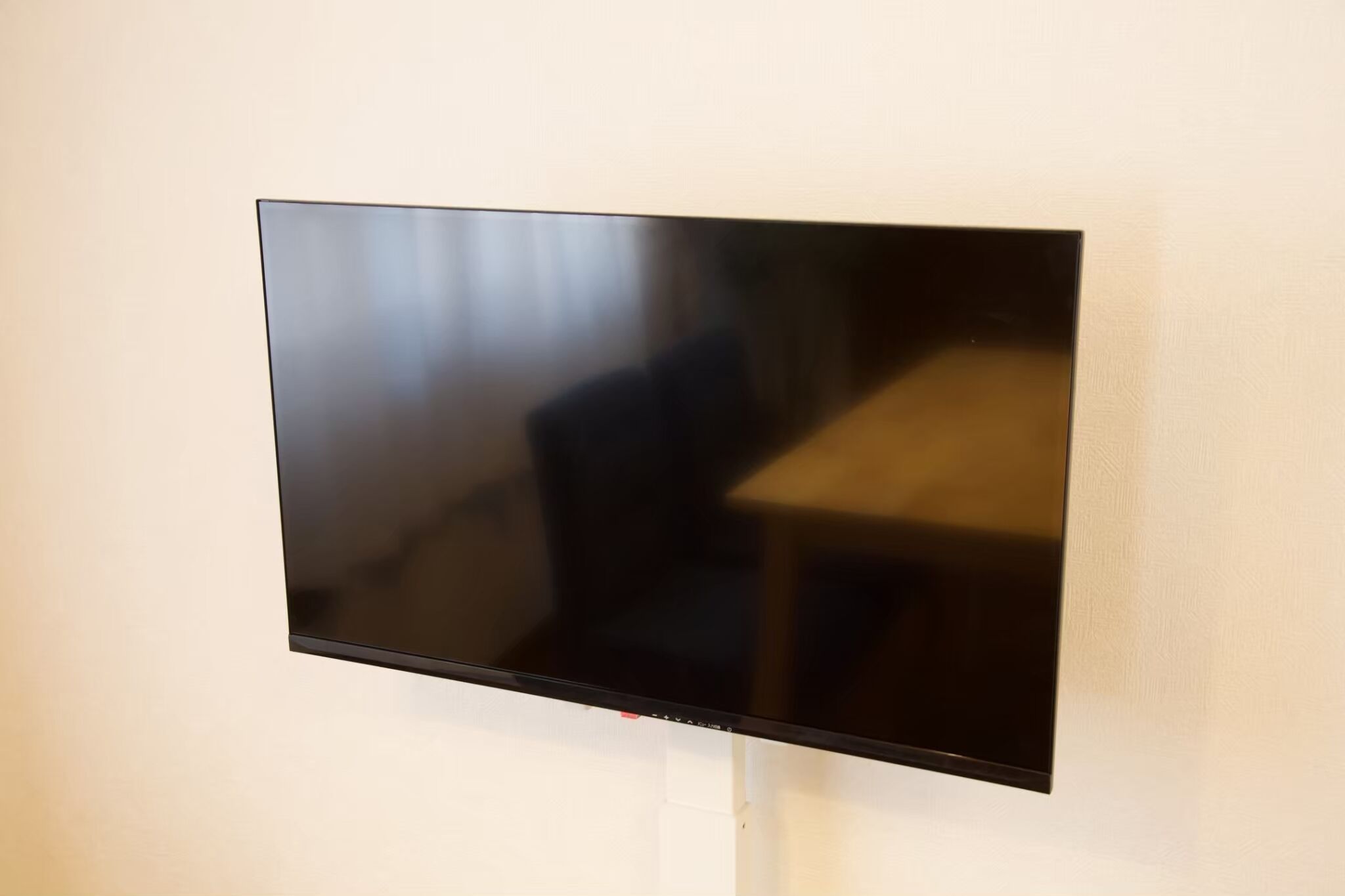 A flat-screen TV mounted on a wall.