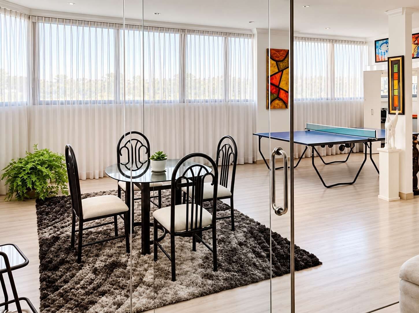 Game room with board game & card table, ping pong and view of the city