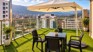 Rooftop patio with views of Tunari mountain