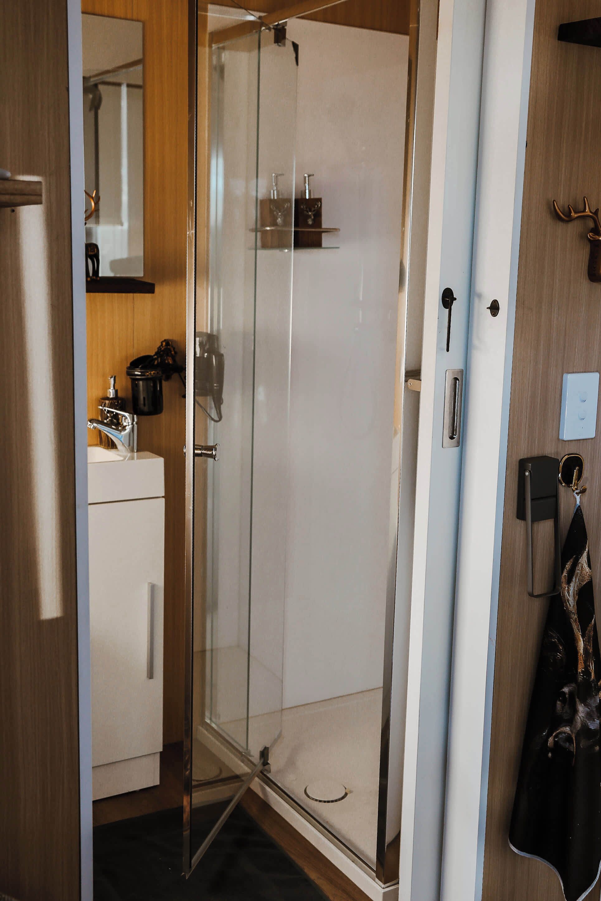 Shower, hair dryer, towels, shampoo