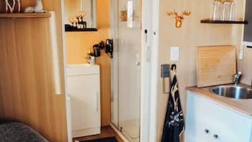 Shower, hair dryer, towels, shampoo