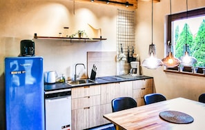 A modern kitchen with a dishwasher, sink, and wooden cabinets. - 2 bedroom beautiful home in Kopalino (Kopalino)