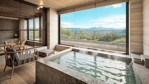 A modern spa area with a hot tub, wooden furniture, and a view of mountains through large windows. - ANDO HOTEL RETREAT HAKONEGOURA (Hakone)