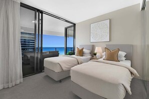A hotel room with two beds, a balcony with a view, and a large window. - Ocean Getaway at Oracle Level 28 (Gold Coast)
