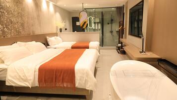A modern hotel room with two beds, a large bathtub, and a glass shower area.