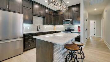 Fridge, microwave, stovetop, coffee/tea maker