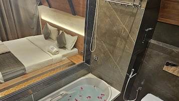 Villa, Balcony, Pool View | Bathroom | Combined shower/tub, towels, soap, shampoo