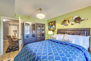 A bedroom with a bed, a wardrobe, a chandelier, and a wall art piece. - Walkable Base Near Dtwn, Penn Station & MetLife (Newark)