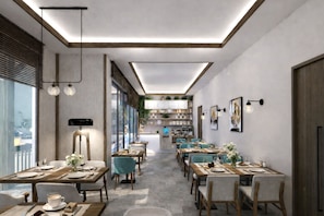 Un comedor moderno con mesas, sillas y una barra central.