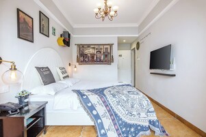 Classic Double Room, Partial Ocean View | Laptop workspace, iron/ironing board, free WiFi