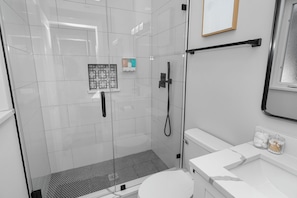 Shower, hair dryer, towels, soap