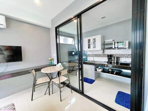 A modern kitchen with a microwave, coffee maker, and cabinets. - Villa 1 - Holiday Villa with Pool, 1 minute from Fisherman's Village (Ko Samui District)