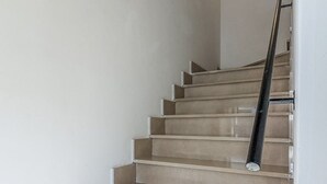 A staircase with a handrail, leading to an upper floor. - Sea and Sun House - Sun Option (Vibonati)