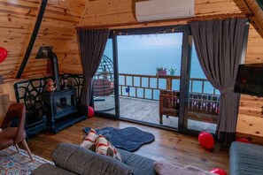 Bungalow Deluxe, vistas al mar | Zona de estar