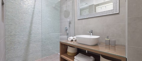 Shower, deep soaking tub, hair dryer, towels
