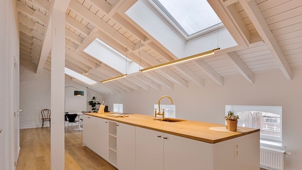 A modern kitchen with a wooden island, white cabinetry, and a skylight. - 3 bedrooms apartment + private parking in Liege historical area (Liège)