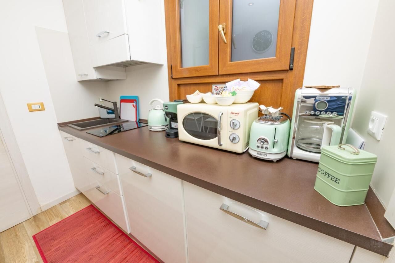 Espresso maker, coffee/tea maker, full-sized fridge, microwave