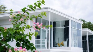 A modern building with large windows and a balcony. - A View Khao Soon  (Chawang)