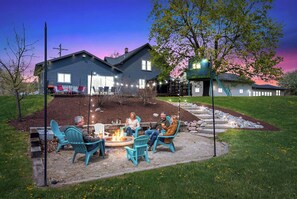 A patio area with outdoor seating and a fire pit. - Walk to Downtown & Elkhart Lake | Firepit (Elkhart Lake)