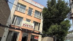 A multi-story building with a sign reading 'HOTEL MARTIN' at the entrance. - Hotel Kartik (Zirakpur)