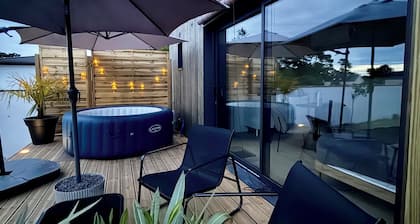 Lodge cosy avec jacuzzi privatif et climatisation