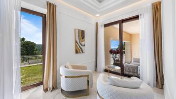 Superior Double Room, Garden View | Living area | TV