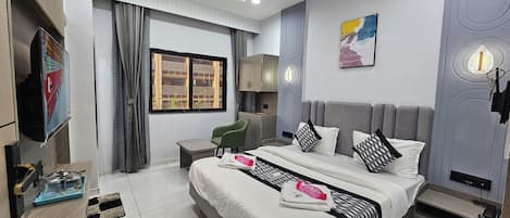 Deluxe Double Room, City View | In-room safe, desk, laptop workspace, iron/ironing board