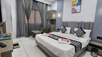 Deluxe Double Room, City View | In-room safe, desk, laptop workspace, iron/ironing board