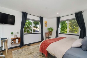 Desk, iron/ironing board, travel cot, free WiFi - A 1,600 sf Coeur d'Alene home with 3 bedrooms, 2 baths, game room, and a backyard built around gardens, gathering, and relaxing in the hot tub. Sleeps 6 & up to 8 with extra beds. Five minutes to the Centennial Trail, ten to downtown CDA. (Coeur d'Alene)
