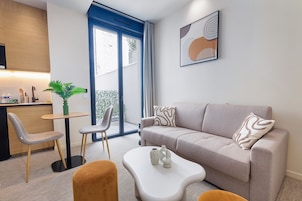 Suite familiar, vistas a la ciudad | Salón