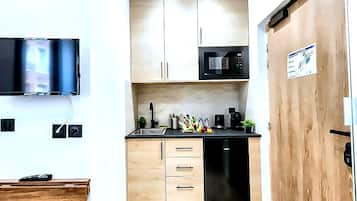 Mini-fridge, microwave, cookware/dishes/utensils