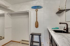 A bathroom with a white shower, a small stool, a towel rack, and a sink with a marble countertop. - Colorado Countryside Living 7 Mi to Chatfield Res! (Louviers)
