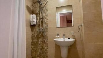 Shower, free toiletries, towels, soap