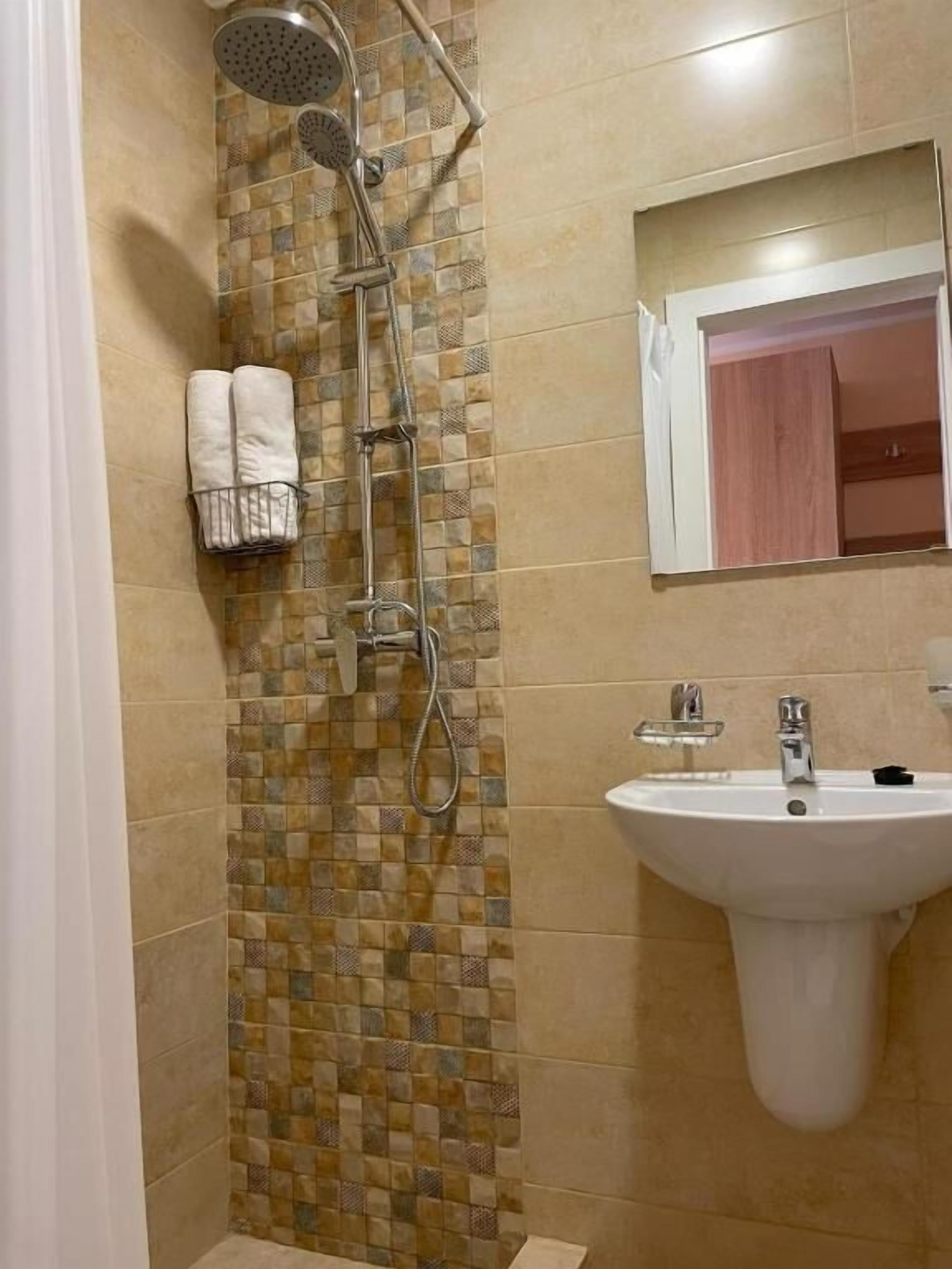 Shower, free toiletries, towels, soap