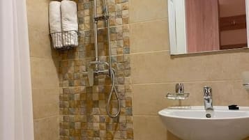 Shower, free toiletries, towels, soap